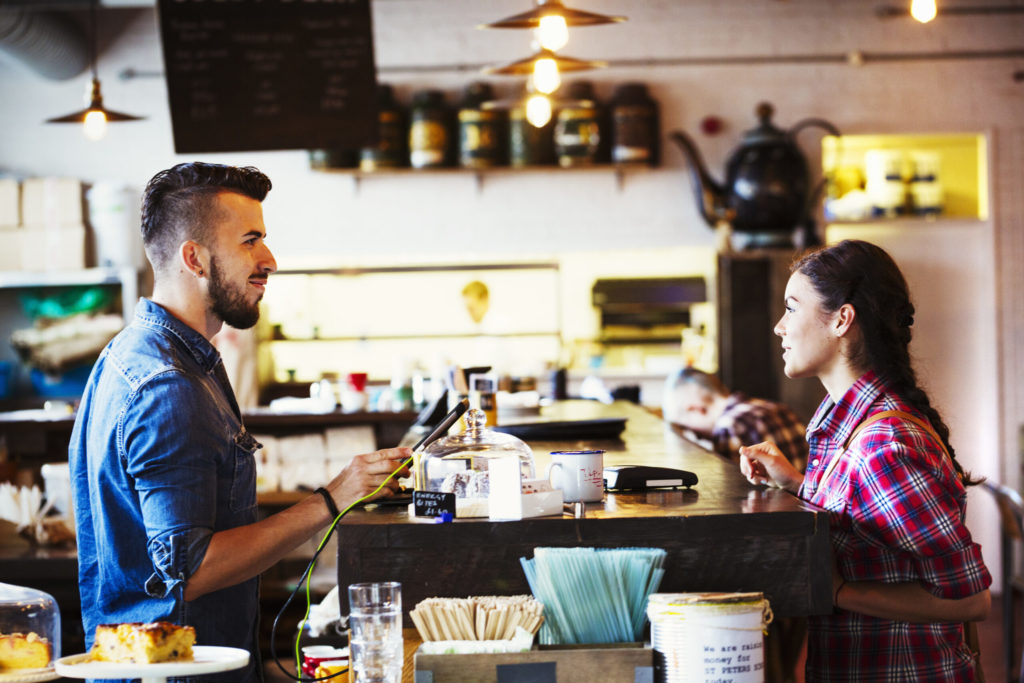 barista-and-customer-in-coffee-shop-2022-03-04-02-39-46-utc-scaled.jpg